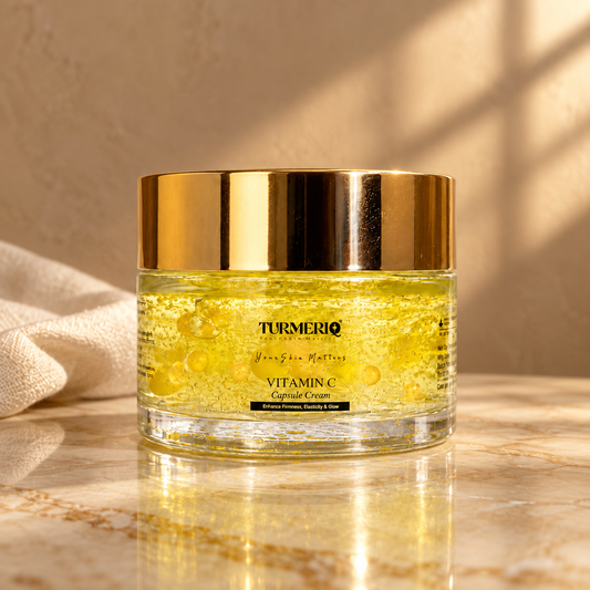 Turmeriq Vitamin C Capsule Cream in a gold-lid jar